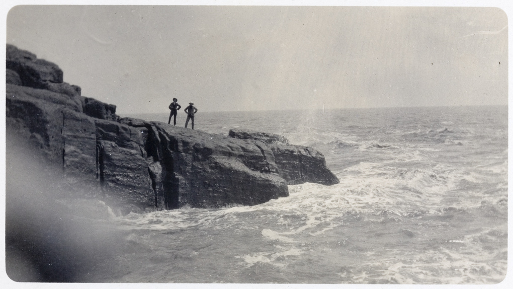 Two men on a rocky outcrop