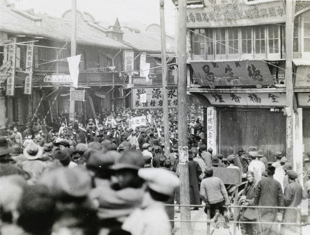 Crowds watching a procession welcoming the Northern Expedition (Nationalist forces), Shanghai, 1927