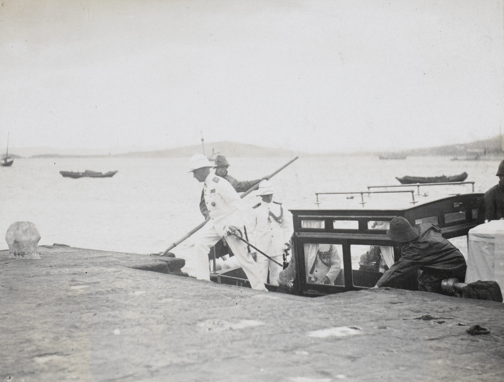 L.C.E. Ayre & D.P. Evans stepping off the boat, 1930