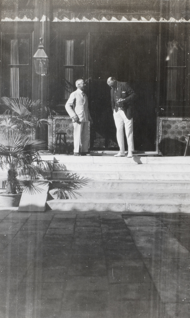 Admiral Sir A. Waistell and Sir Miles Lampson chatting on the steps of British Legation, Beijing