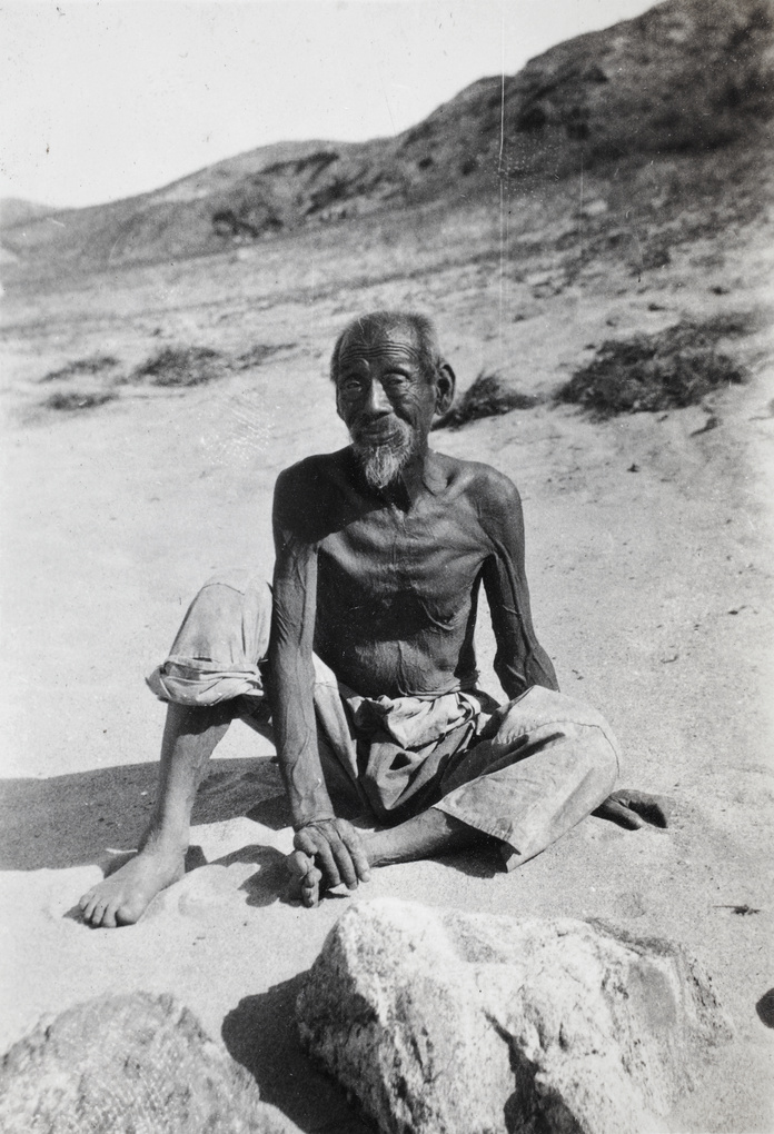 A tanned, elderly man on the beach, Weihaiwei