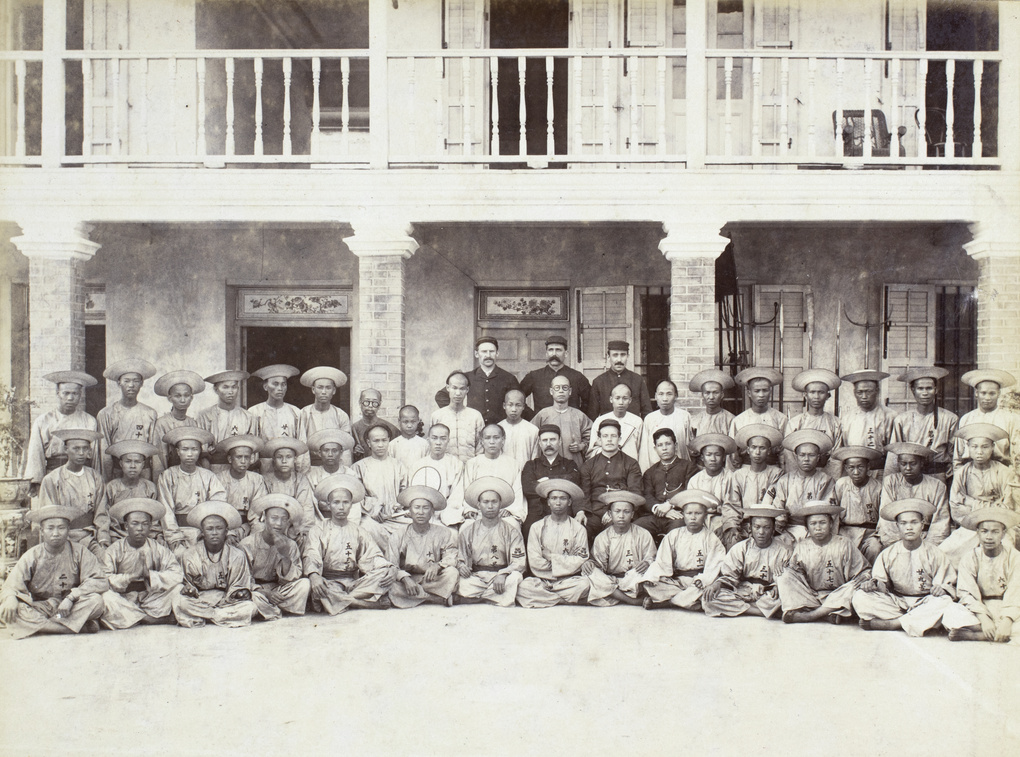 Chinese boatmen and clerks, and European staff