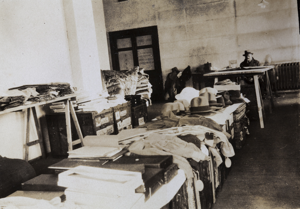 Clothes and other items laid out on trunks in a room, with Percy and Marjorie Ephgrave, Shanghai