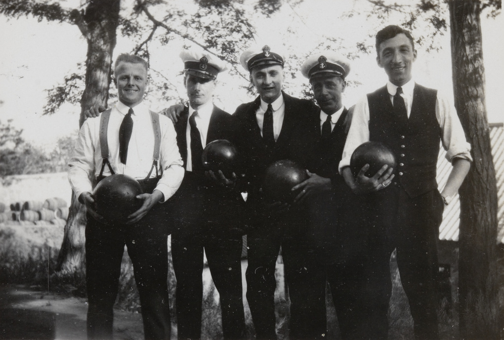 F. Hagger with other Royal Navy sailors holding bowling balls