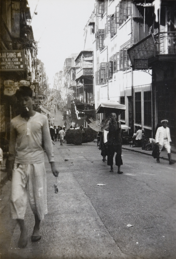 A street with several tailor shops, Hong Kong