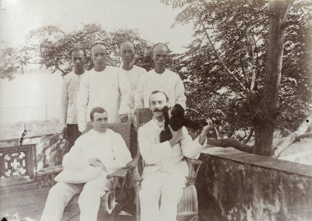 R.F.C. Hedgeland with E. H. de St. Croix, servants and Jacko, Hoihow