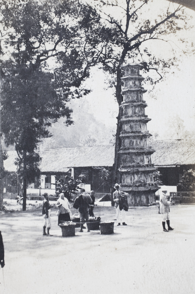 Pedlars and tourists near a pagoda, Lingyin Temple, Hangzhou