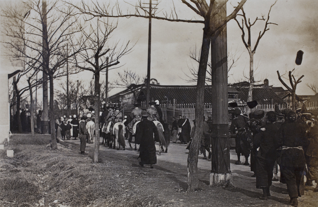 Funeral procession, with mourners in ceremonial clothing on horseback, Shanghai