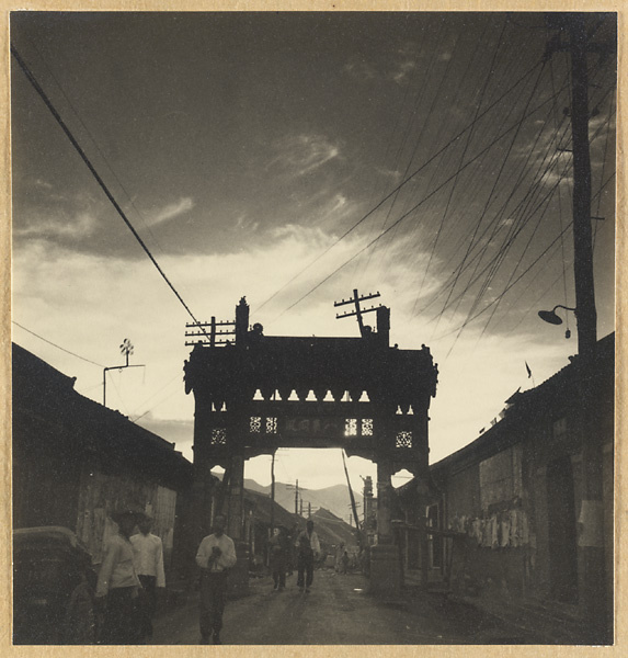 Pai lou on a street in Chendge at dusk