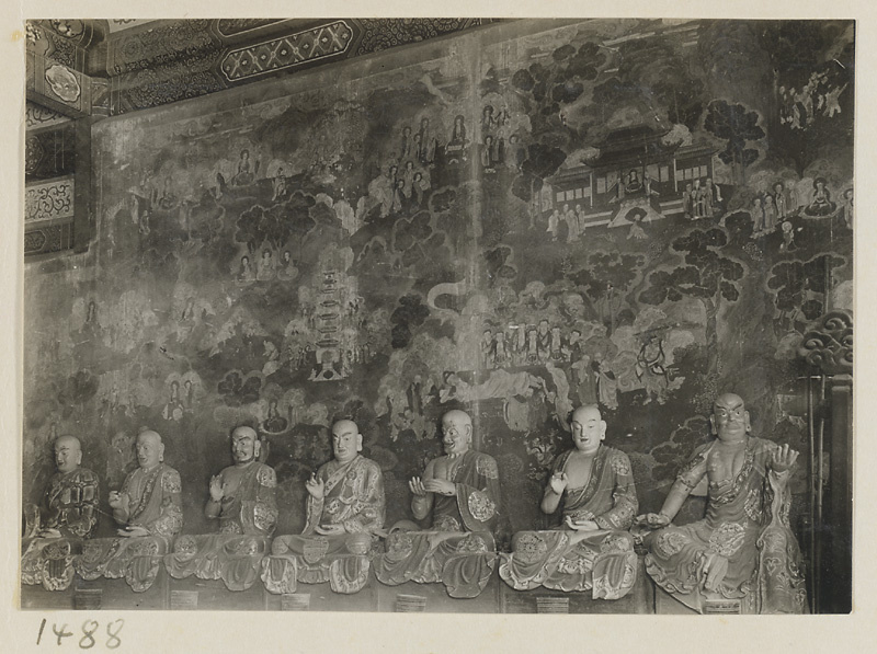 Interior view showing statues of seven Luohans in front of a mural at Qian men temple or Guan di miao