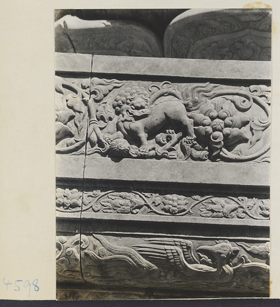 Detail of marble relief carving showing lion, phoenix and lotus flowers at Yuquan Hill
