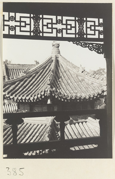 Balcony with latticework overlooking the roofs of temple buildings at Wan shou si