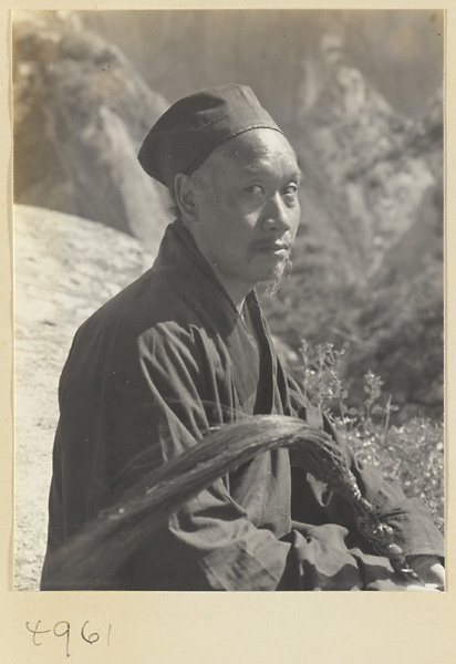 Daoist priest with a yak-tail fly whisk on North Peak Ridge of Hua Mountain