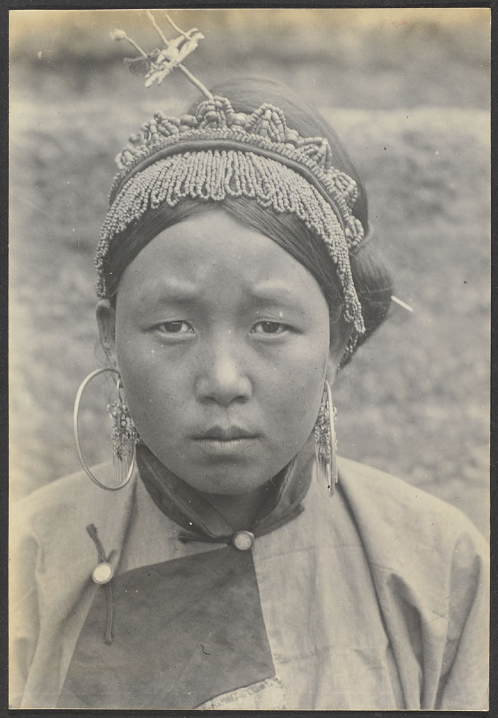 Aboriginal girl from Kuanting.  These folks of the same race and language as the Tung Hsiang Moslems.  Both are of Mongol origin.