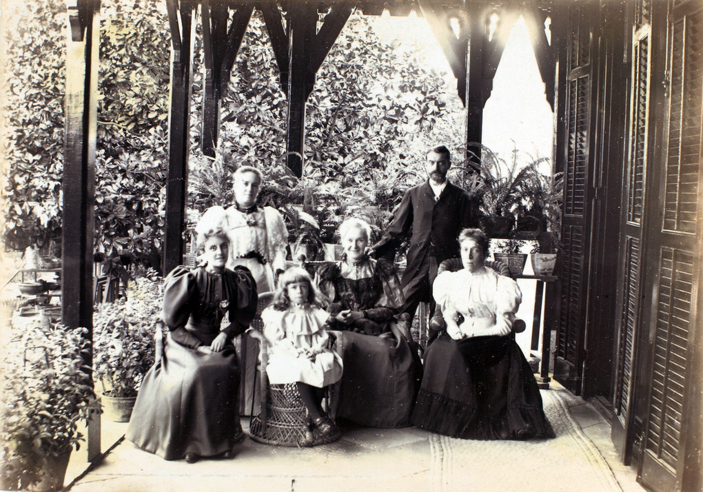 Ethel Mary Maitland (née Wilcockson) and others, posed on a veranda