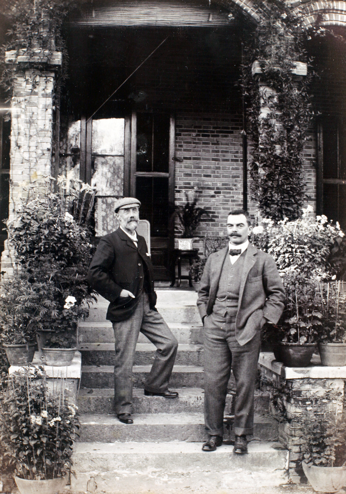 Herbert Wilcockson and Ernest George Hayward on steps by a house, Shanghai