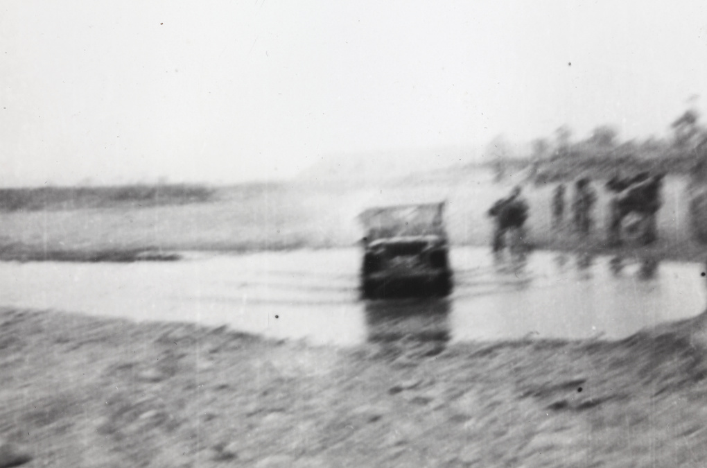 Stanfield's jeep crossing a stream