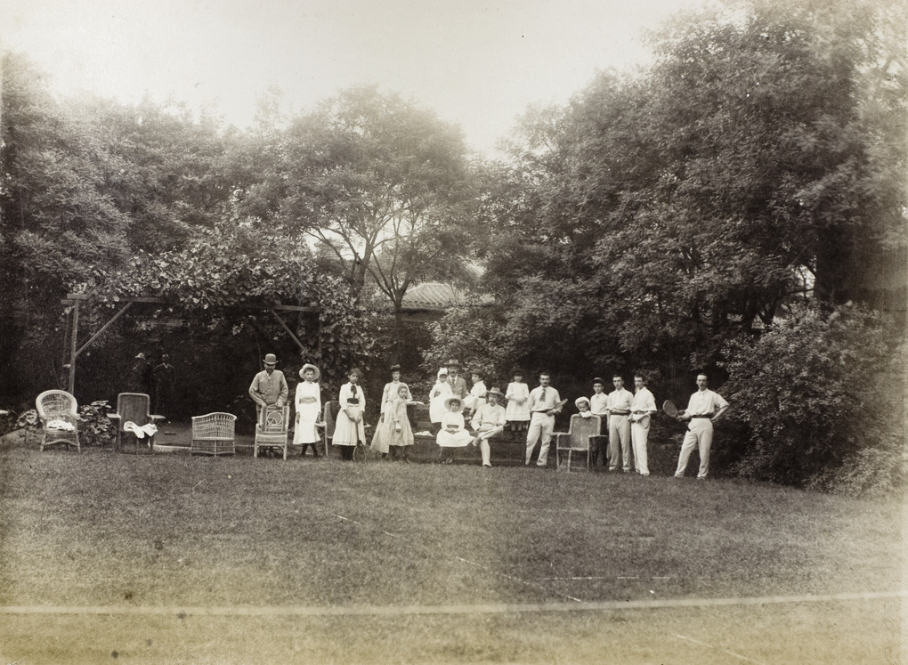 Group beside a tennis court, at the residence of Sir Robert Hart, Beijing