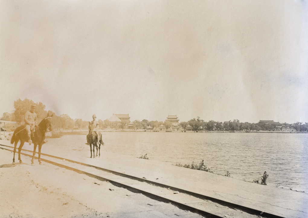 Mounted foreign troops beside the Imperial light railway track, Beihai, Peking