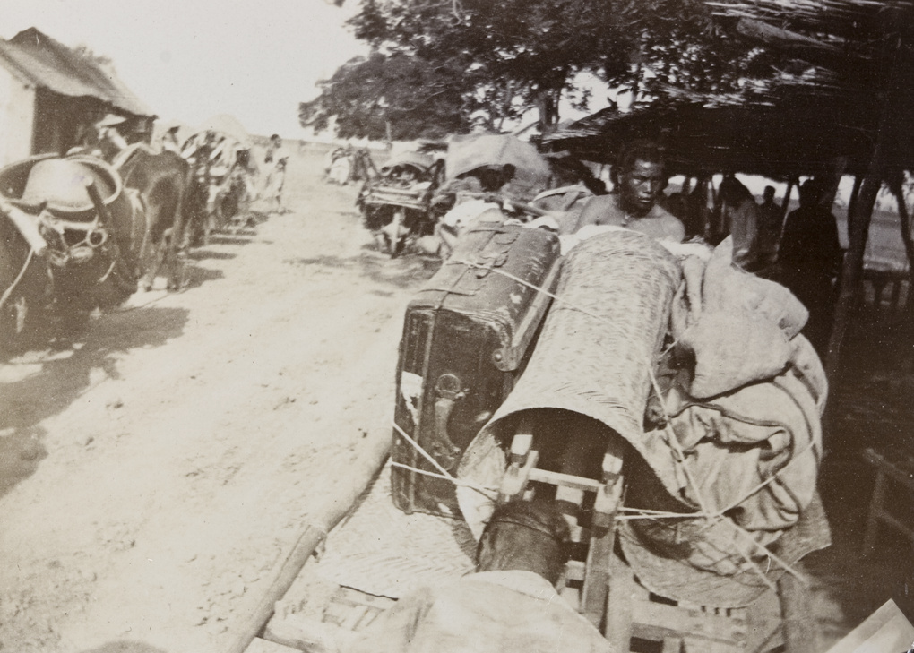 Wheelbarrows loaded with the luggage of official British travelling group, Shandong