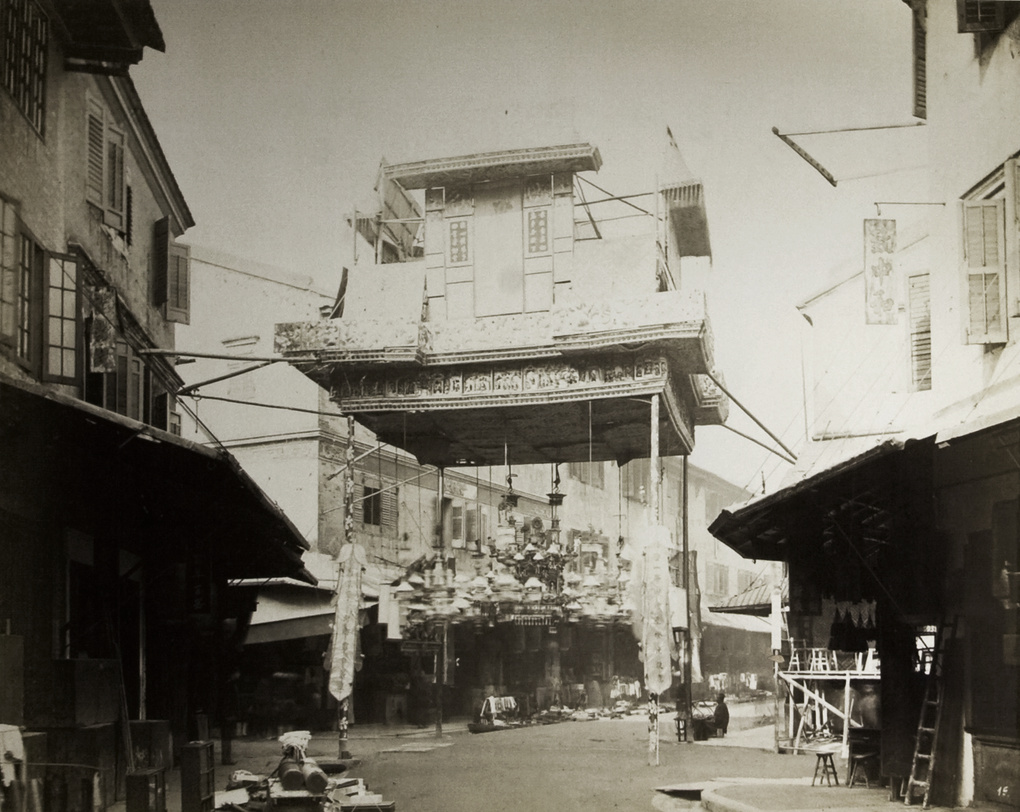 Close view of a decorative gateway on a Chinese street (possibly Queen's Road), Hong Kong, 1869