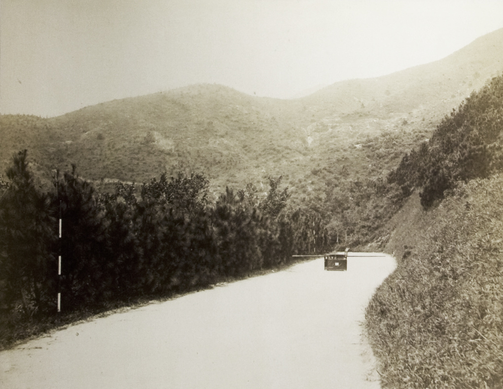 A sedan chair being left in the middle of the road, Hong kong