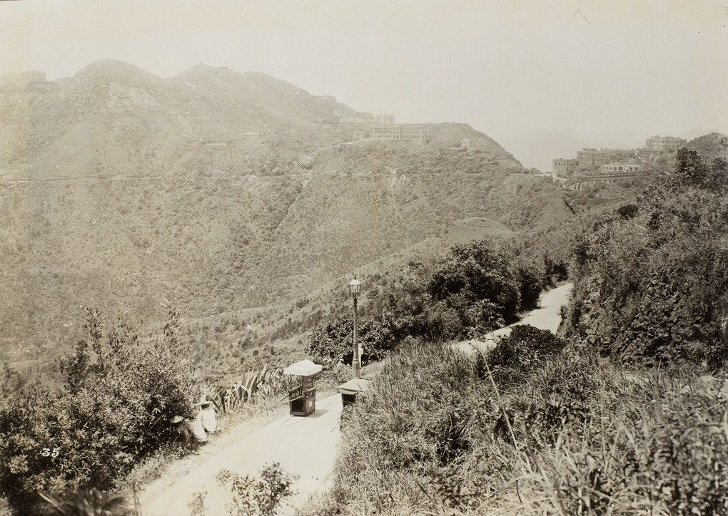 A sedan chair on a path beside a lamp post, Victoria Peak, Hong Kong
