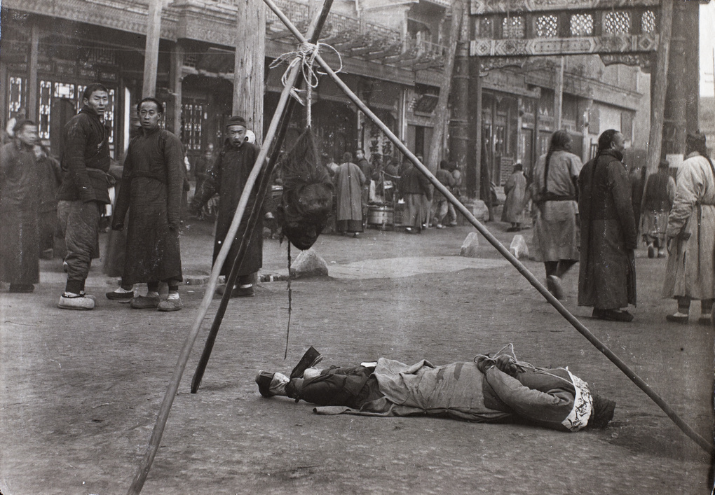 Exposure of decapitated rioter, Peking 1912
