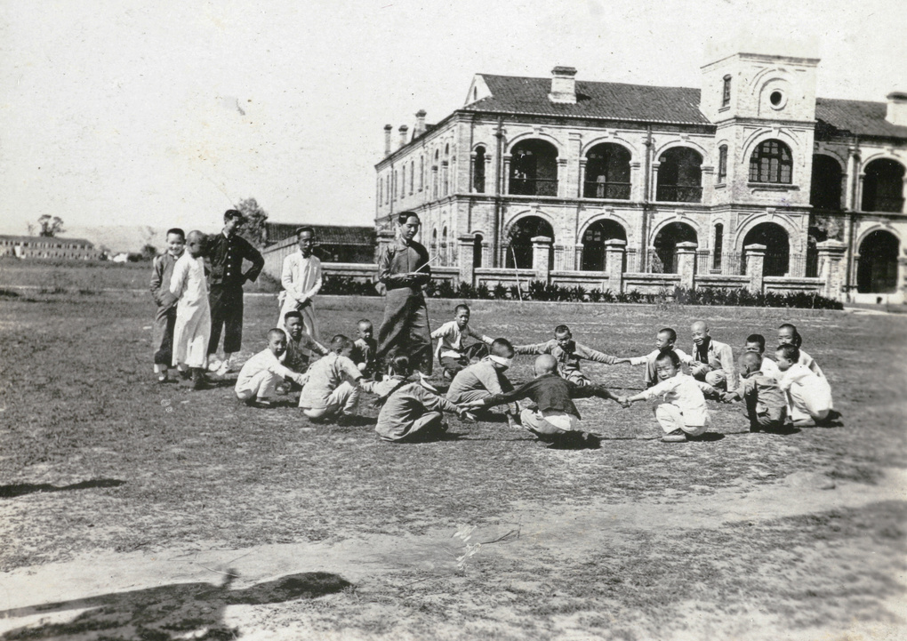 School children playing beside Ichang railway station, c.1925