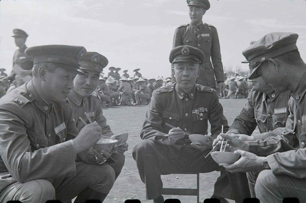 Senior National Army officers eating rice