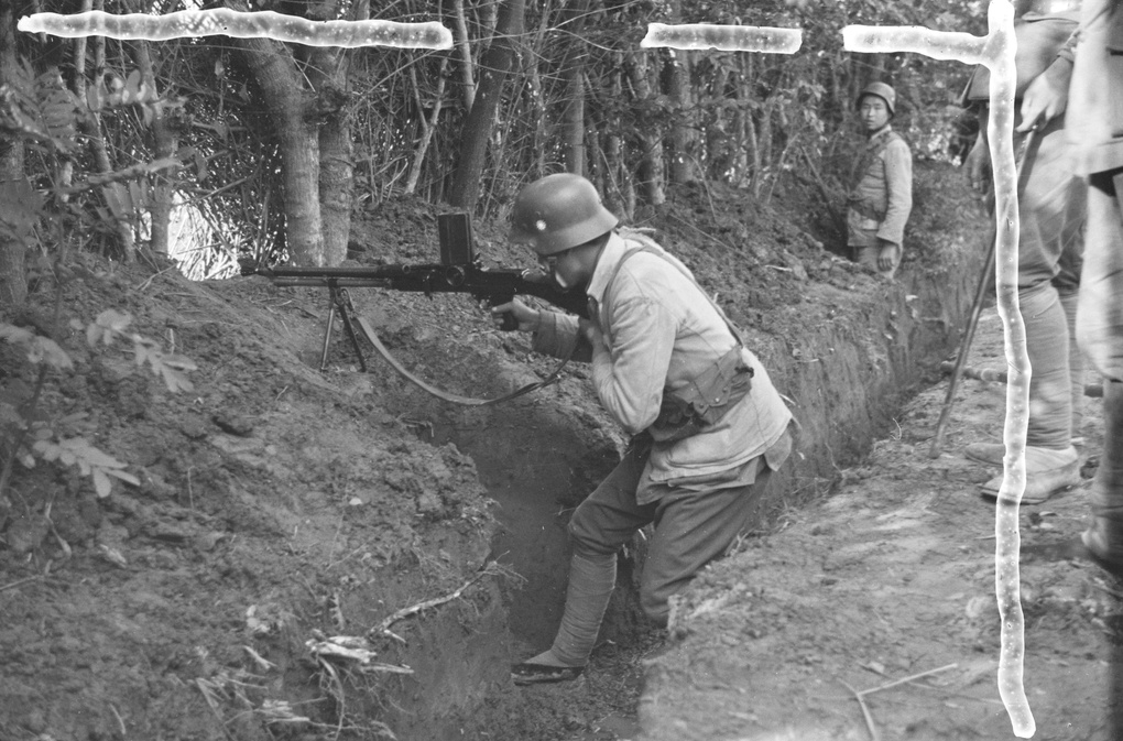 Nationalist soldiers in trench, with machine gun