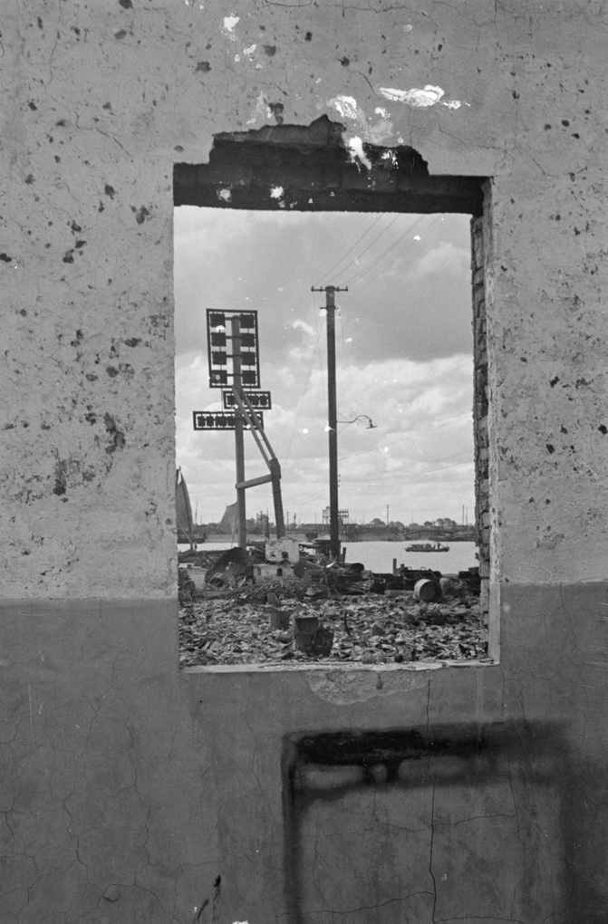 Bomb site seen through damaged window, Shanghai