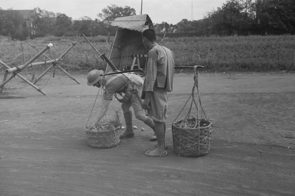 British soldier searching basket of vegetables, Shanghai