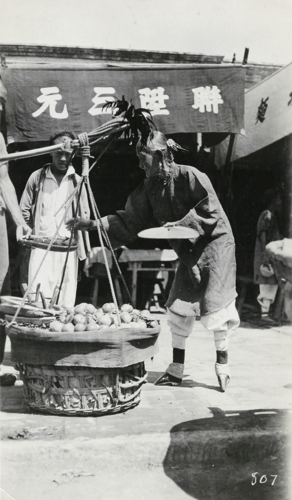 Buying fruit from a street seller, Beijing