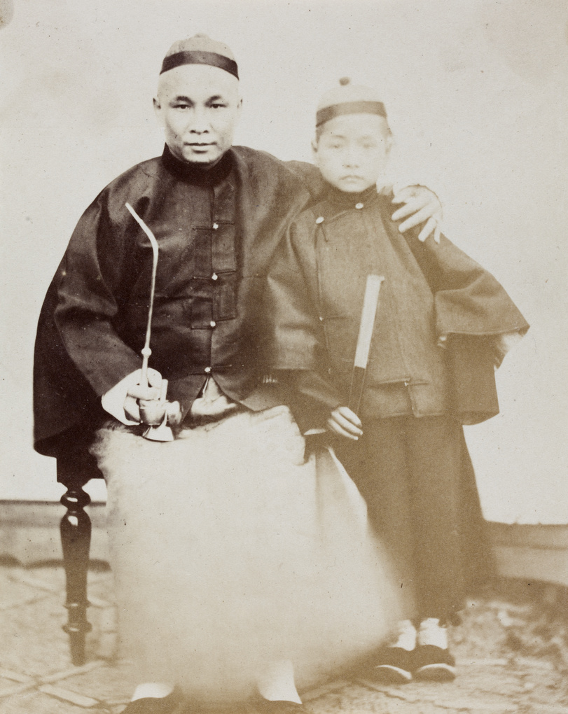 Warden's Compradore with a pipe, and his son with a fan, Shanghai
