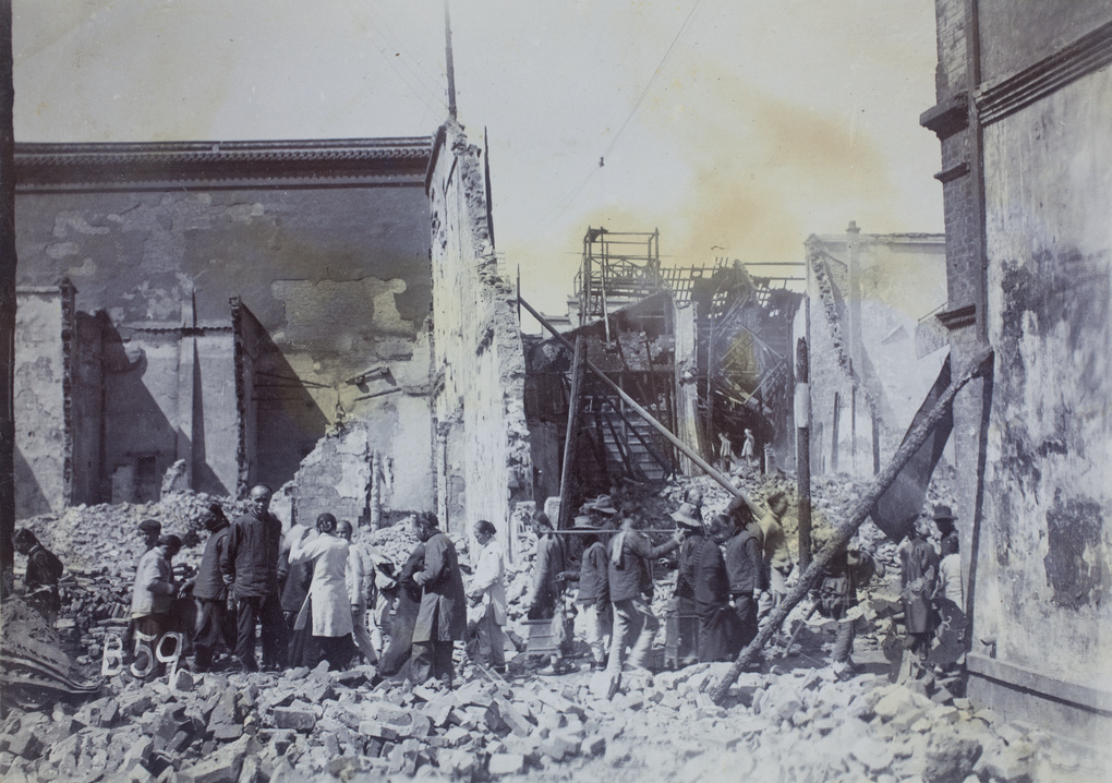 People on a street among the ruins of Hankow