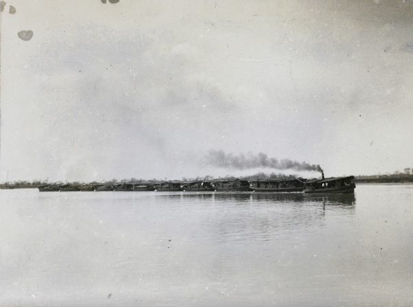 A boat train, led by a steam boat