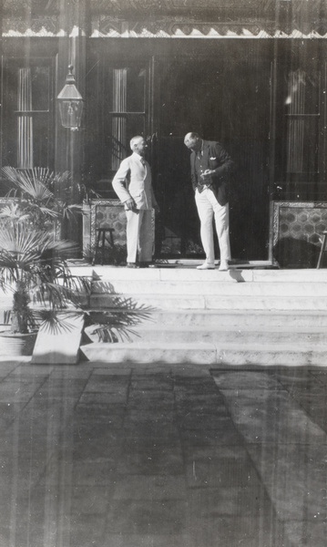 Admiral Sir A. Waistell and Sir Miles Lampson chatting on the steps of British Legation, Beijing