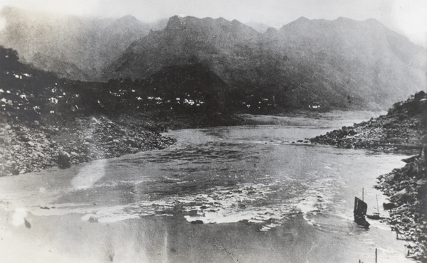 Two small junks by the river bank