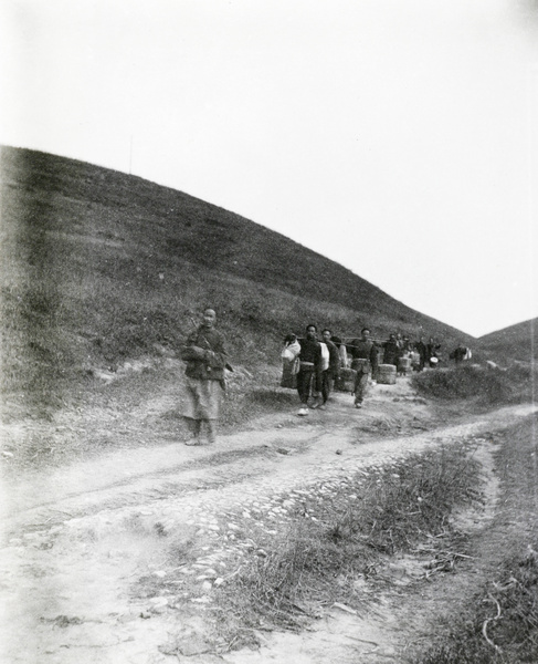 Carrying luggage along a road