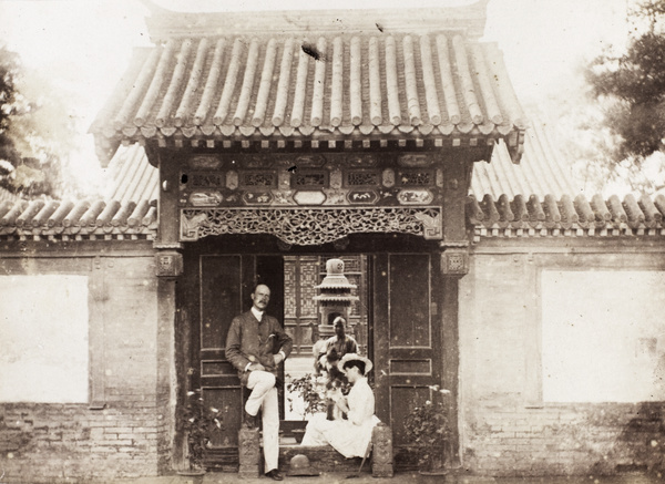A European couple beside entrance to house, Peking (北京)