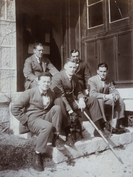 Group of of men on a doorstep