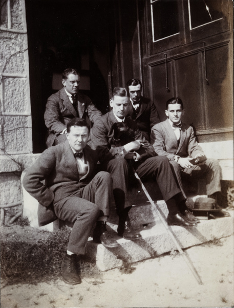 Group of men on a doorstep