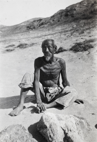 A tanned, elderly man on the beach, Weihaiwei