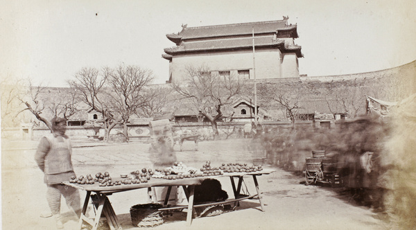 The Outer Tower and the temple in the gateyard, Andingmen, with produce stall, Beijing