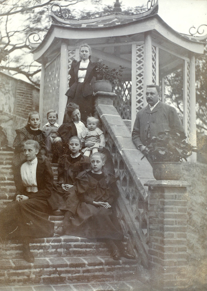 The Carrall family by a garden pavilion