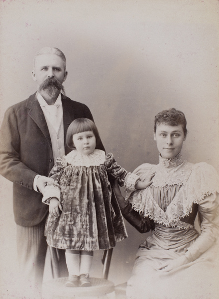 Studio portrait of D.M. Henderson and family