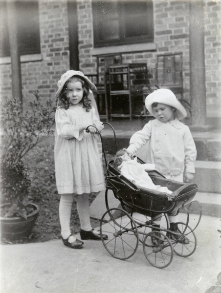 Dare Elliott with her new doll in a pram, at home in Paoning