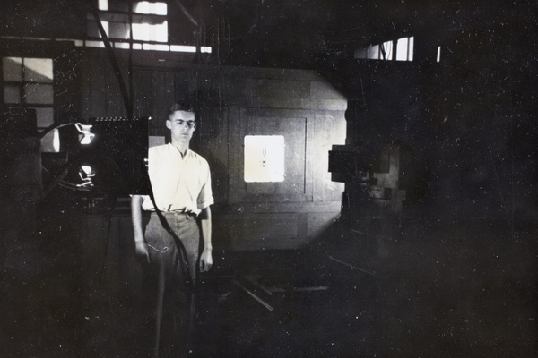 Jack Ephgrave in photography room with arc-lamps and camera, Pudong, Shanghai