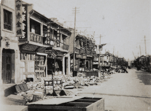 Debris in front of war damaged shops, Shanghai, 1932